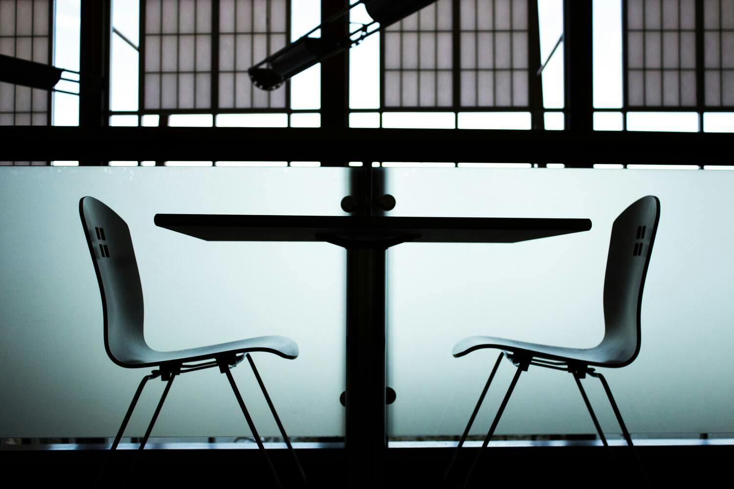 Two chairs and a table set up for an interview