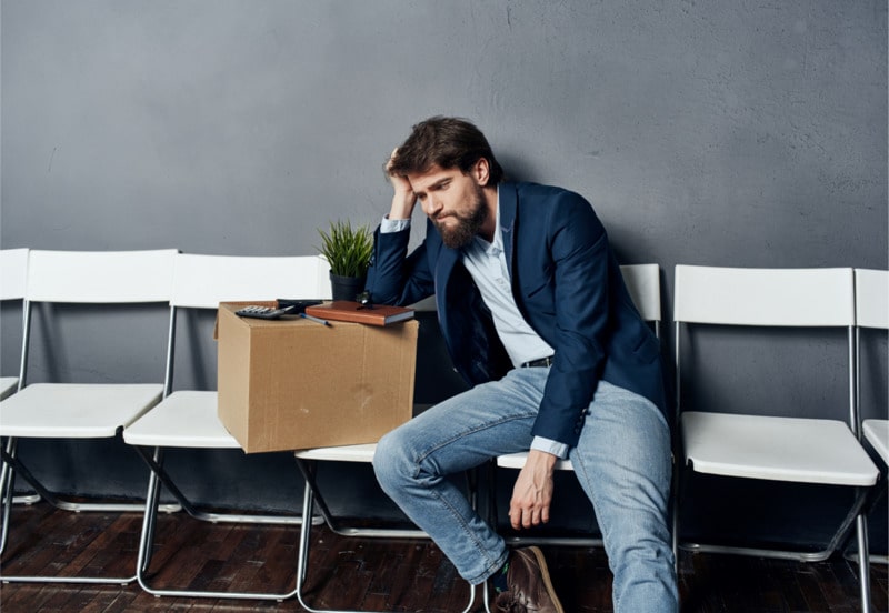 Person with a box of his stuff that's just been sacked after a disciplinary