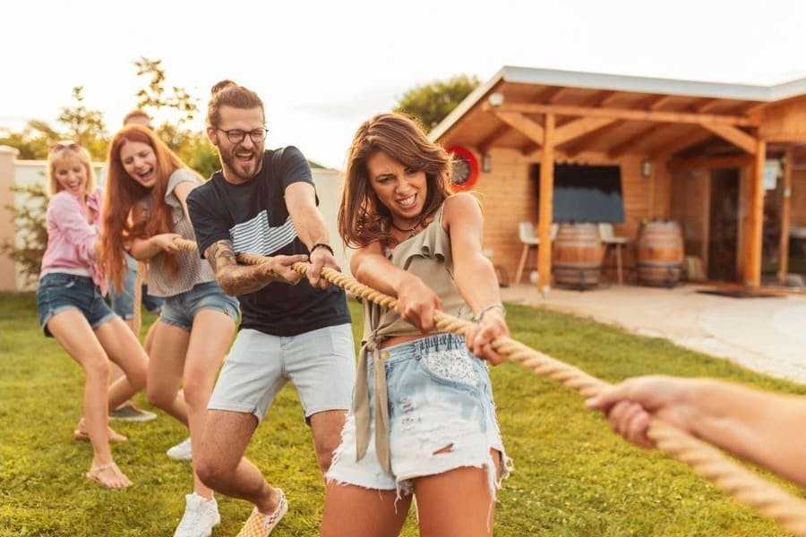Employee motivation A team building exercise between colleagues playing tug of war