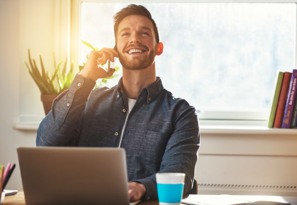 Person working from home on the phone feeling motivated