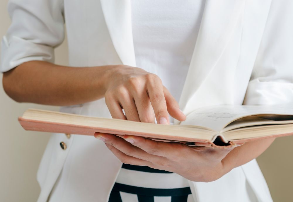 A member of staff reading the employee handbook