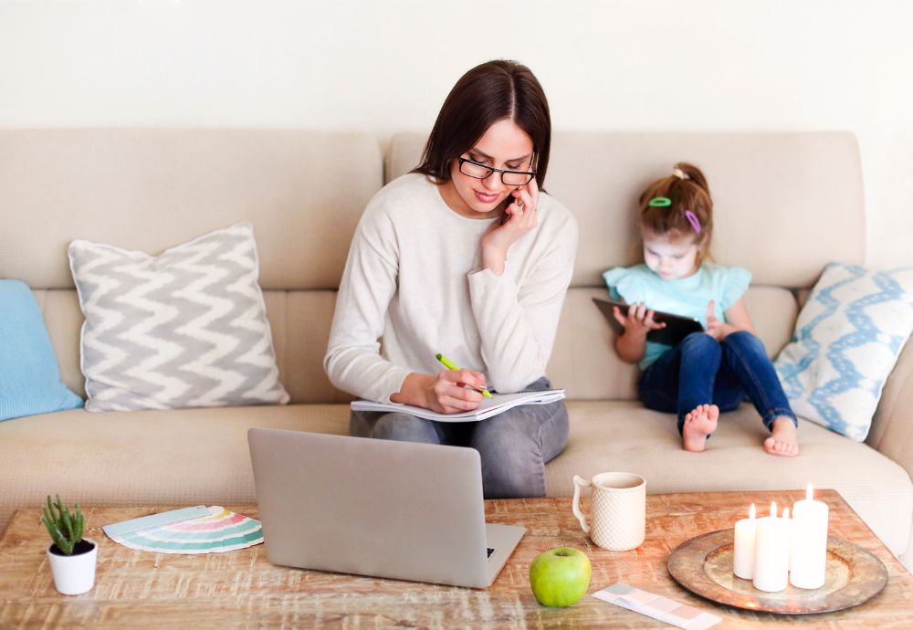 A person working from home with their child causing a home life distraction