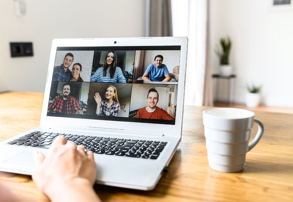 A person on an online meeting with other colleagues whilst working from home