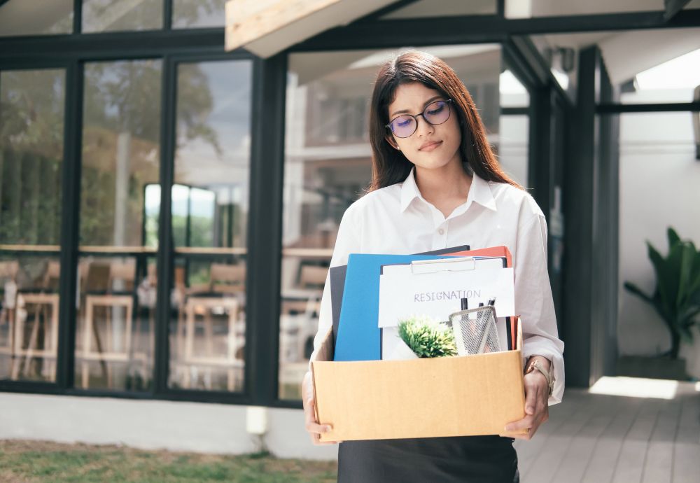 Someone carrying their belongings after quitting work and not working notice period