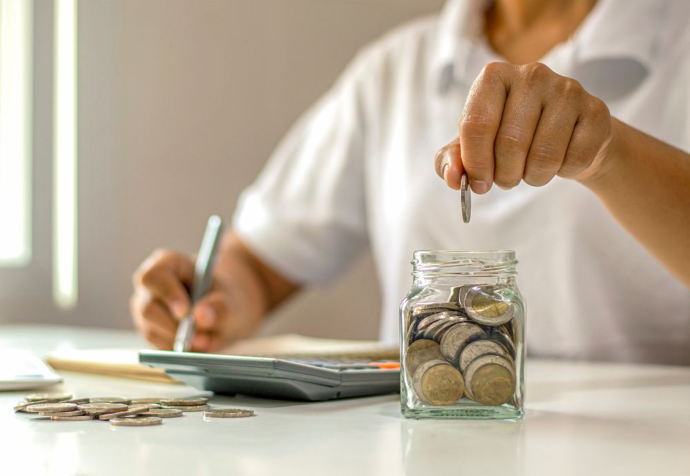 A person counting the Canadian minimum wage they've just earnt