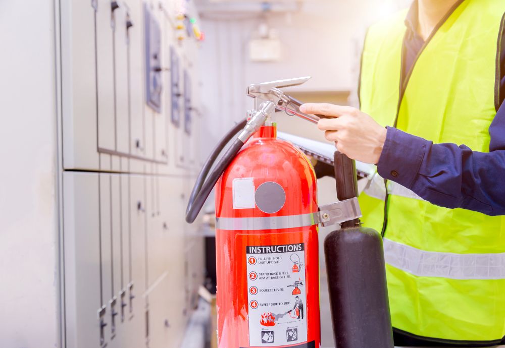 An inspector testing a Fire extinguisher