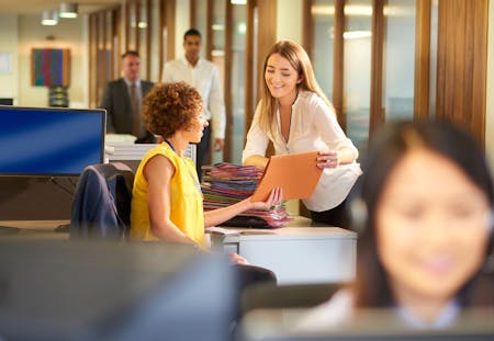 HR and employment law in the office Two ladies discuss employment law