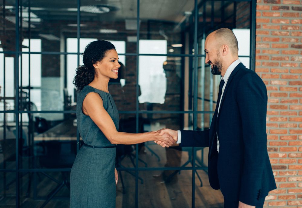 Two people meeting with a handshake