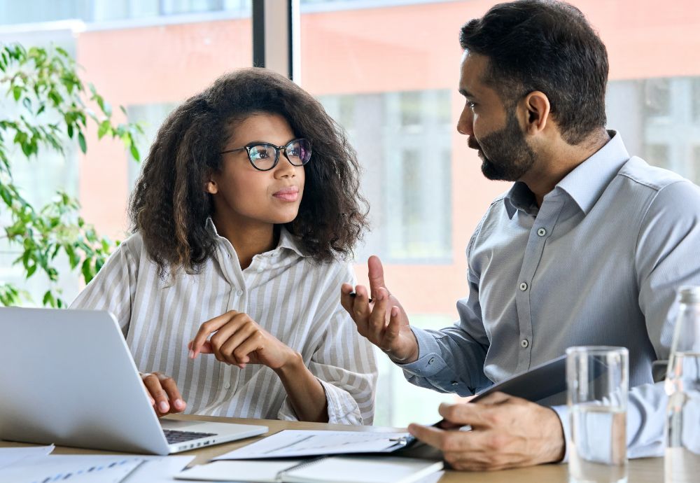 A man Micromanaging a women employee