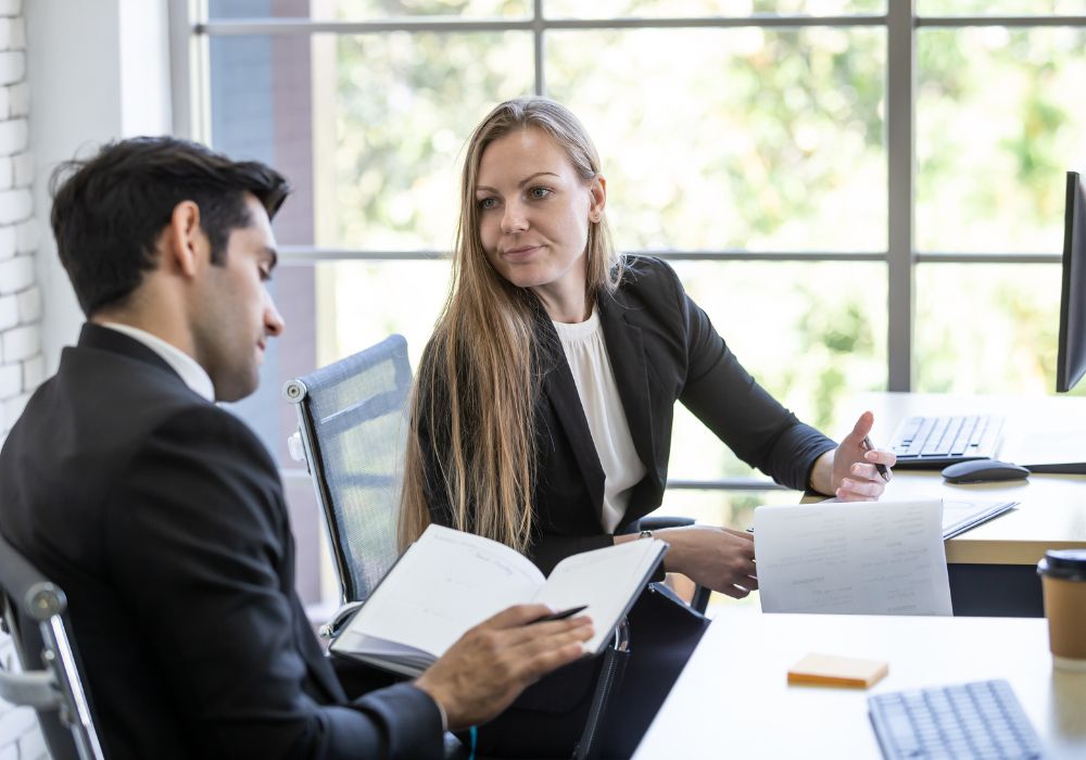 Two people having a meeting on terms of their probation