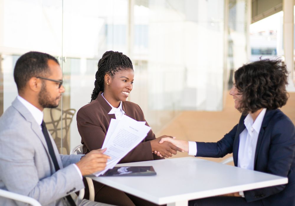 3 people meeting after a grievance is solved