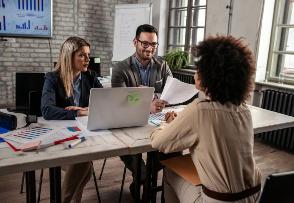 2 people interviewing a person for a new job