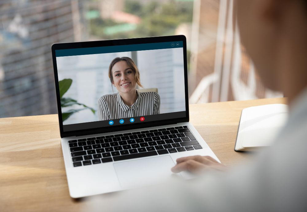 A person having a meeting online whilst someone is working from home after recent absence