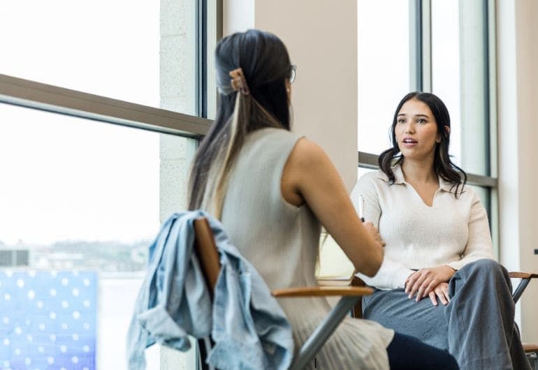 A probation review meeting between two people