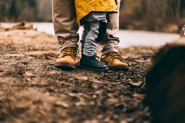 Father and sons feet in outdoors