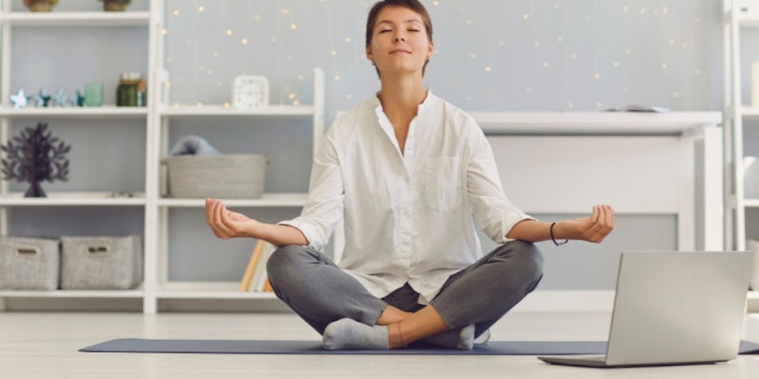 Employee meditating looking after their mental health