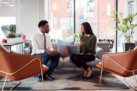 HR Outsourcing male business owner and female hr expert discussing outsourcing HR
