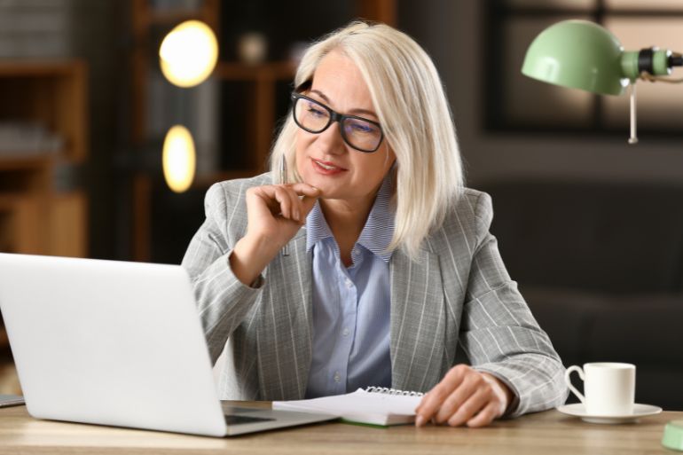 female business owner researching HR software pricing