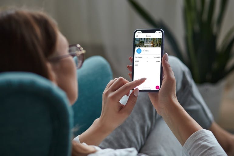 Female manager using BrightHR's app to track holiday