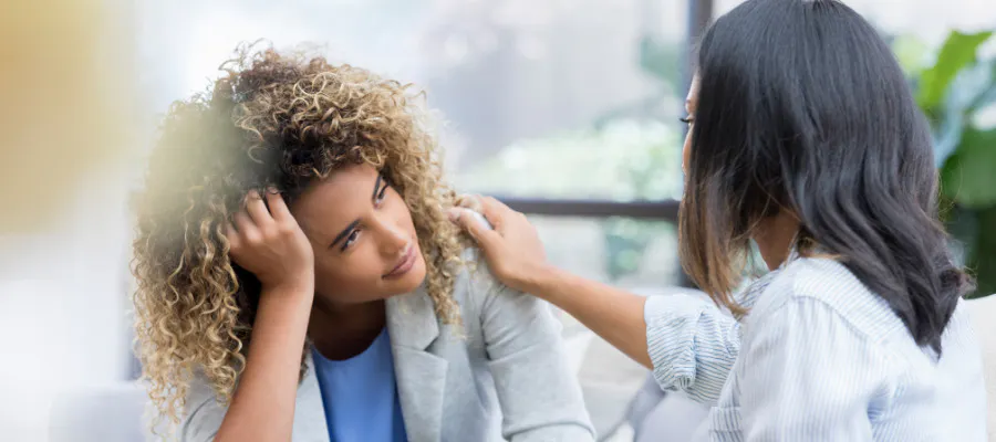 female employers supporting female employee with mental health