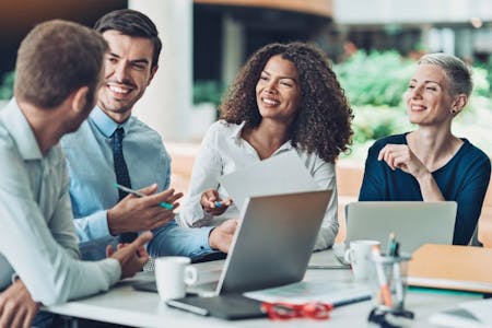 Unauthorized absence Office meeting with business individuals strategizing on unauthorized absence management through HR software