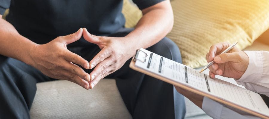 A man completing a health assessment