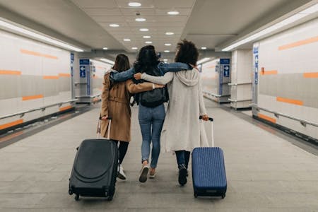Types of leave from work Group of women going on holiday taking annual leave from work at an airport