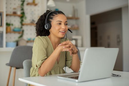Managed payroll service employee on the phone helping businesses manage their payroll
