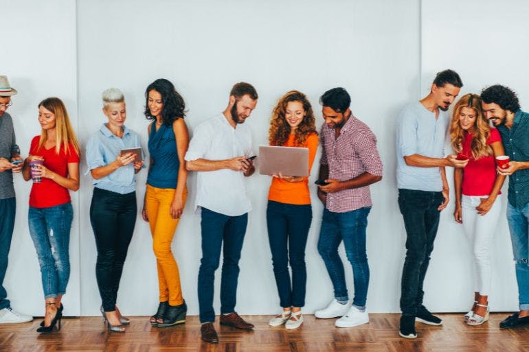 HR Technology Line of employers using smartphones, tablets and laptops symbolizing HR Technology.