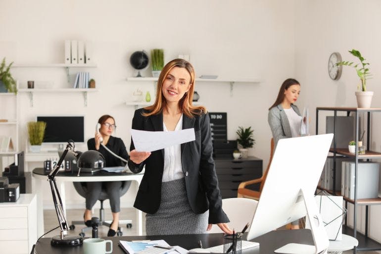 Female business owner accounting for payroll.