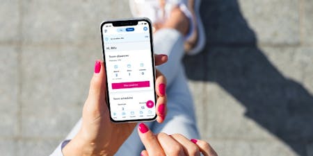 Vacation tracking app Female hands with smartphone featuring BrightHR