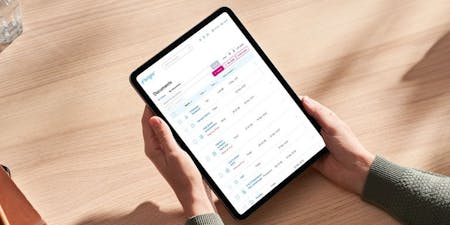 File sharing Hands grasping an iPad featuring BrightHR