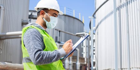 Safe work method statements for Australian businesses A construction site manager filling out a SWMS