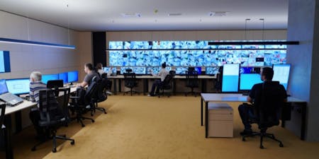 Display screen equipment Room with several individuals working diligently at computers, equipped with display screen equipment for their tasks