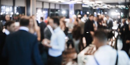 A blurred image of a social event amongst work colleagues