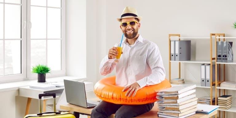 Employee end of year leave Employee ready to take annual leave sat on a desk