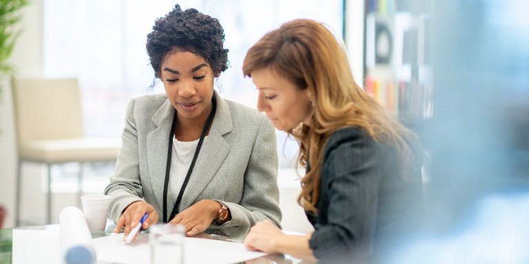 Manager and employee in a one-to-one meeting