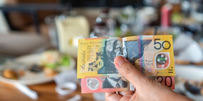 Hand holing Australian Dollars