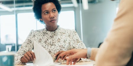 Flexible contract of employment Employee and employer consulting over a flexible working request in an office setting