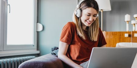 Flexible working Employee working from home with laptop and headset