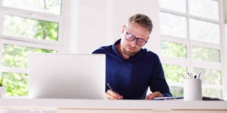 Online health and safety training An employee completing an online training course from their desk