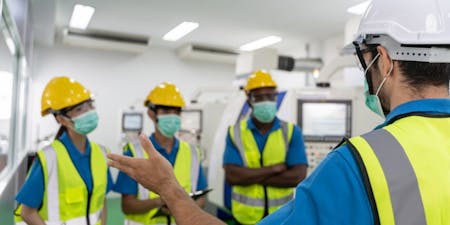 Health and safety training Employees wearing PPE completing health and safety training