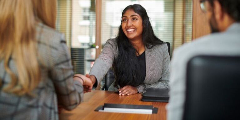 3 people taking part of a formal job interview