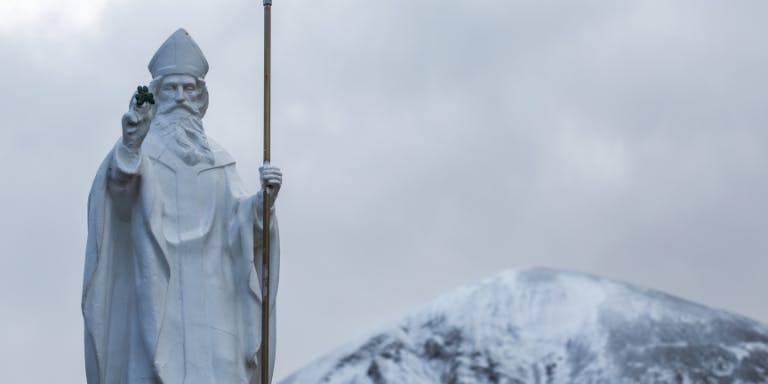 Statue of St Patrick on Croagh St Patrick, covered in snow