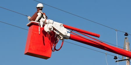 Working at height health & safety training A telecommunications engineer working on overhead wires