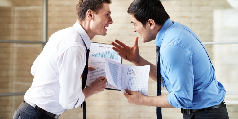 Two employees in a heated conversation