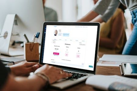 Leave management system Laptop displaying BrightHR dashboard