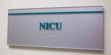 NICU neonatal care Image of a NICU signage on a wall in a hospital