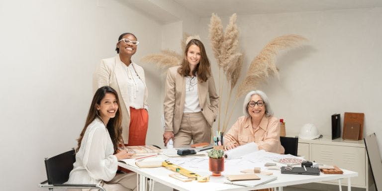International Women's Day Women in the workplace planning a project together