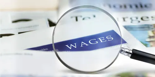 A close-up of a news article discussing wage trends and their impact on workers and the economy.